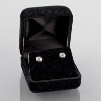 Lot 1131 - PAIR OF DIAMOND STUD EARRINGS each set with a...