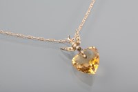 Lot 1137 - EDWARDIAN CITRINE AND SEED PEARL SWALLOW MOTIF...