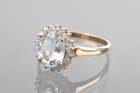 Lot 1143 - AQUAMARINE AND DIAMOND CLUSTER RING set with...