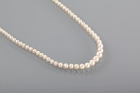 Lot 1159 - GRADUATED PEARL NECKLACE with a nine carat...