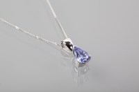 Lot 1166 - TANZANITE PENDANT the pear shaped stone set in...