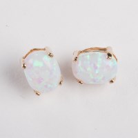 Lot 1168 - PAIR OF OPAL STUD EARRINGS each set with an...