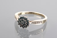 Lot 1172 - BLUE AND WHITE DIAMOND CLUSTER RING with a...