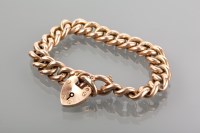 Lot 1176 - NINE CARAT GOLD CURB LINK BRACELET with a...