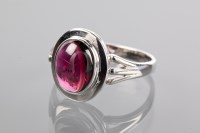 Lot 1180A - GARNET RING the oval cabochon cut garnet set...