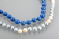 Lot 1186 - LAPIS LAZULI BEAD NECKLACE with a fourteen...