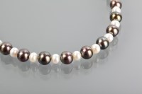 Lot 1192 - BLACK AND WHITE PEARL NECKLACE formed by...