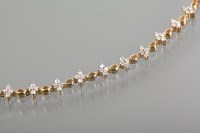 Lot 1194 - DIAMOND SET BRACELET with groups of four...