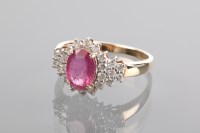 Lot 1206 - RUBY AND DIAMOND RING the central oval ruby...