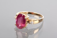 Lot 1208 - LARGE RUBY AND DIAMOND RING the large oval...