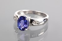 Lot 1210 - TANZANITE AND DIAMOND RING the oval tanzanite...