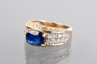 Lot 1212 - SAPPHIRE AND DIAMOND DRESS RING the oval...