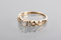Lot 1217 - DIAMOND RING the central oval diamond flanked...