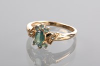 Lot 1224 - GREEN GEM SET CLUSTER RING set in nine carat...