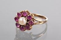 Lot 1225 - RUBY AND PEARL CLUSTER RING the central white...