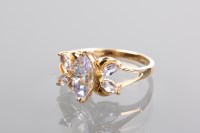 Lot 1226 - GEM SET RING the pink-lilac gems set in nine...