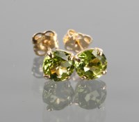 Lot 1230A - PAIR OF PERIDOT STUD EARRINGS each set with an...