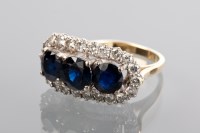 Lot 1239 - IMPRESSIVE SAPPHIRE AND DIAMOND RING the three...