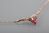 Lot 1259 - DIAMOND AND PINK GEM SET NECKLACE set with...