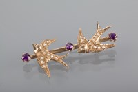 Lot 1264 - AMETHYST AND PEARL SET SWALLOW MOTIF BAR...