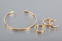 Lot 1278 - GUCCI EIGHTEEN CARAT GOLD TORC BANGLE along...