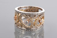 Lot 1292 - UNUSUAL DIAMOND DRESS RING the broad pierced...