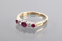 Lot 1294 - RUBY AND DIAMOND FIVE STONE RING set with...