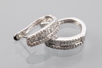 Lot 1299 - PAIR OF DIAMOND EARRINGS each with channel set...