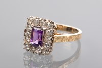 Lot 1302 - AMETHYST AND DIAMOND RING set with three oval...