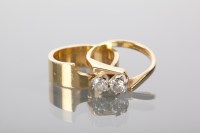 Lot 1309 - DIAMOND TWO STONE RING set with two brilliant...