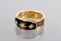 Lot 1311 - ENAMELLED MOURNING RING with a central star...