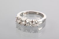 Lot 1322 - DIAMOND FOUR STONE RING set with four...