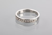 Lot 1323 - DIAMOND HALF ETERNITY RING channel set with...