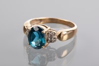 Lot 1347 - TOPAZ AND DIAMOND DRESS RING the oval blue...