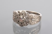 Lot 1349 - DIAMOND DRESS RING set with a central...