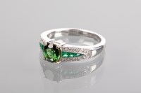 Lot 1358 - DIAMOND AND GEM SET RING the central round...