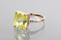 Lot 1361 - PERIDOT DRESS RING the rectangular peridot...