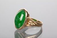 Lot 1370A - JADE RING set with an oval cabochon cut jade,...