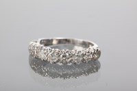 Lot 1385 - DIAMOND HALF ETERNITY RING set with brilliant...