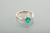 Lot 1100 - EMERALD AND DIAMOND DRESS RING the central...