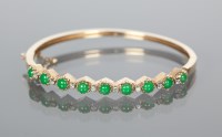 Lot 1105 - JADE AND DIAMOND BANGLE set with round...