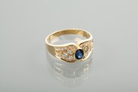 Lot 1114 - EIGHTEEN CARAT GOLD SAPPHIRE AND DIAMOND RING...