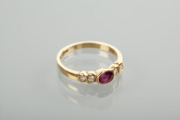 Lot 1115 - EIGHTEEN CARAT GOLD RUBY AND DIAMOND RING the...