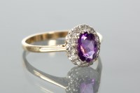 Lot 1119 - OVAL AMETHYST AND DIAMOND CLUSTER RING set...