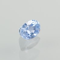 Lot 1142 - UNMOUNTED SAPPHIRE the light blue oval stone...