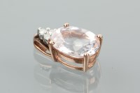 Lot 1146 - MORGANITE AND DIAMOND PENDANT the oval...