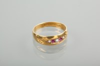 Lot 1158 - RUBY AND PEARL RING set with two rubies and...