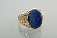 Lot 1179 - GENTLEMAN'S LAPIS LAZULI SET RING with an oval...