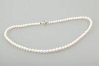 Lot 1182 - CULTURED PEARL NECKLACE formed by graduated...