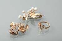 Lot 1193 - TWO NINE CARAT GOLD FLORAL SPRAY BROOCHES...